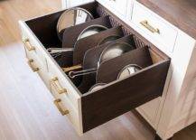 sideways pans stored inside deep drawer kitchen island