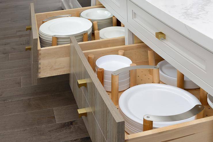 white plates in open drawer peg dividers