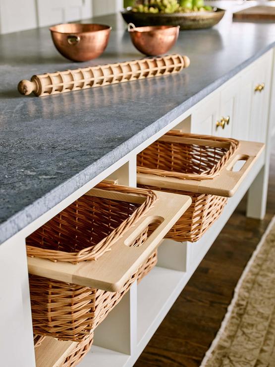wood wicker baskets fruit and veggie storage under counter island in kitchen wood rolling pin copper bowls