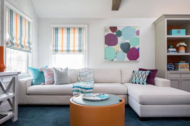 orange and purple living room with large sectional sofa pillows