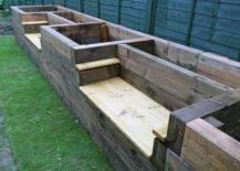 wooden benches with garden beds built in on grass