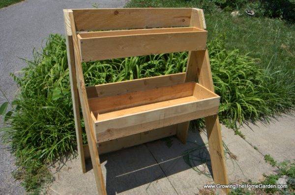 raised garden bed stand two tier grass in background