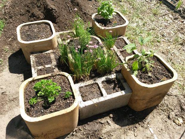 masonry brick cylinders used for raised garden bed