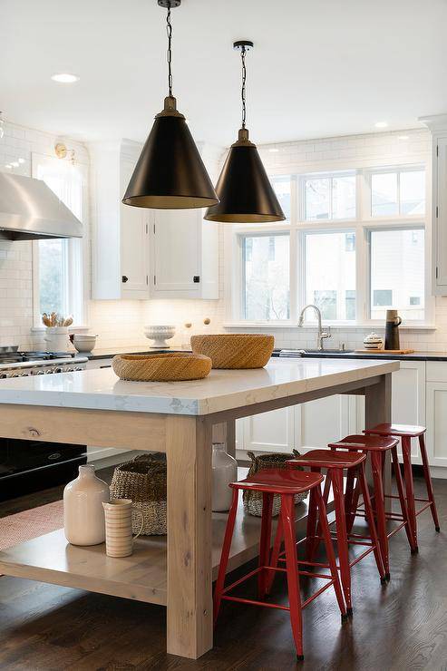 red stools in a black and white kitchen hanging pendants island large window