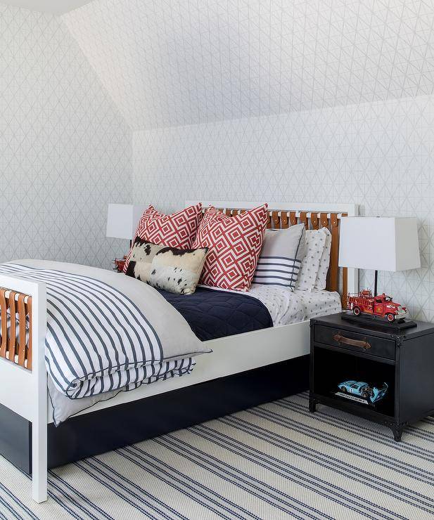 red navy and brown boy's bedroom with striped carpet nightstand and table lamp white bedding