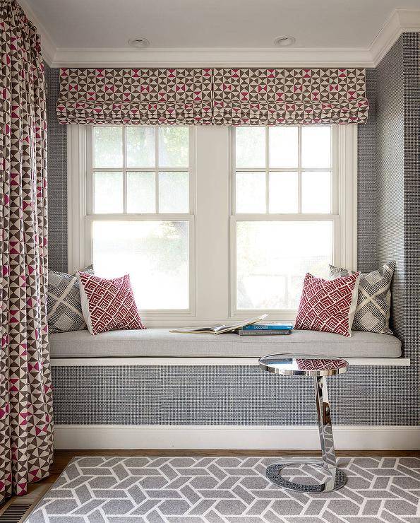 Red and Gray Sitting Area with pillows large window and curtains