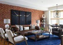 red brick wall in living room with brown leather couch texas longhorn wall art sitting chairs