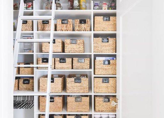 seagrass baskets in pantry white ladder