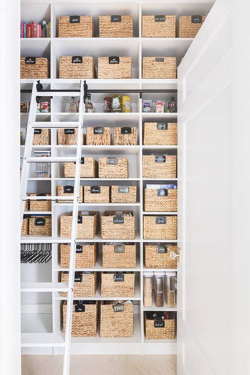 seagrass baskets in pantry white ladder