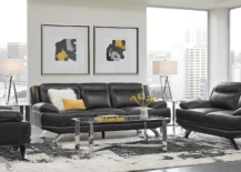 black leather sofa and couch in living room with yellow accents