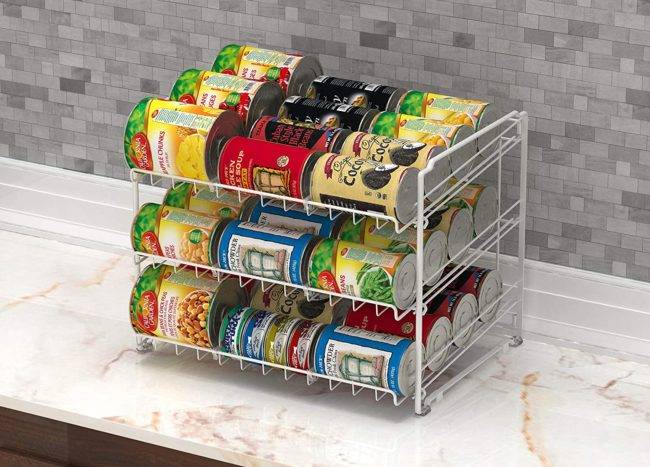 wire soup holder with cans of soup on counter