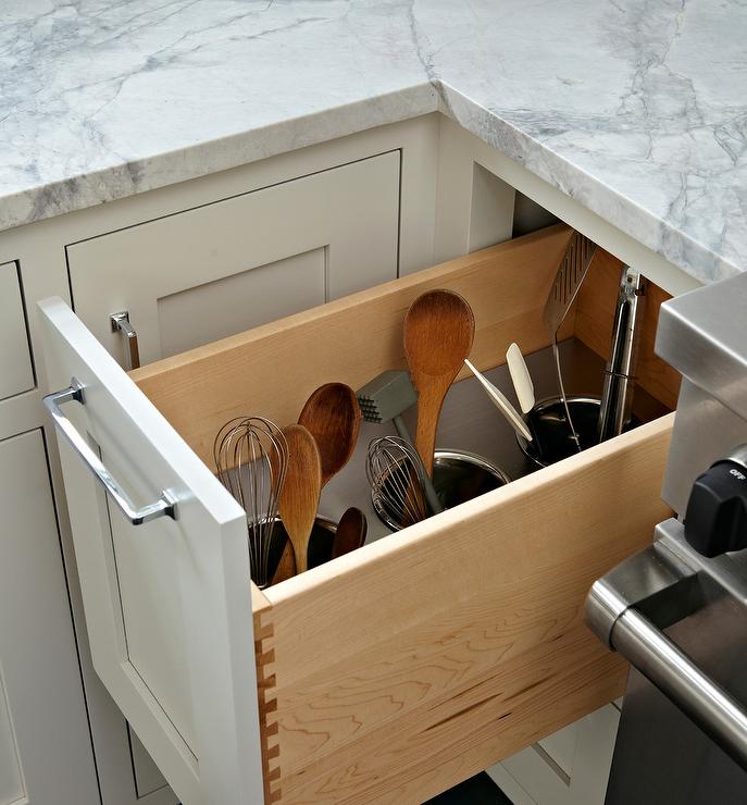 wooden spoons spatulas and whisks stored secretly inside drawer holder marble countertop
