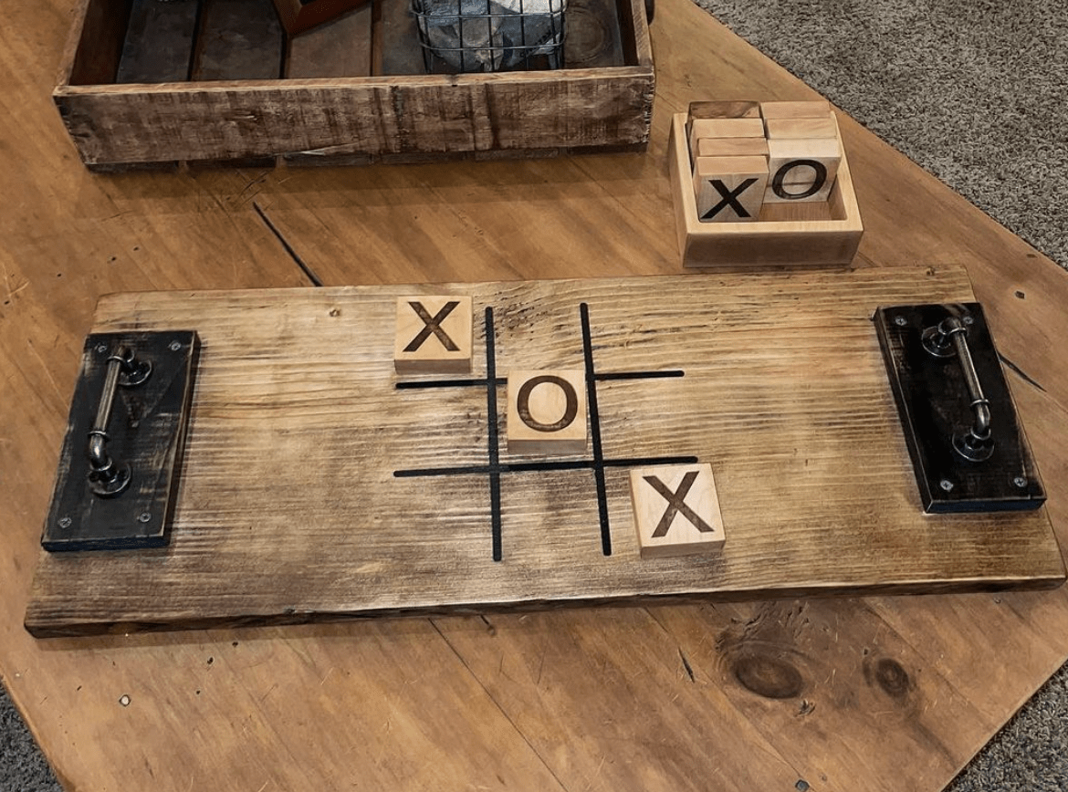 tic tac toe wood burnt game on wooden table
