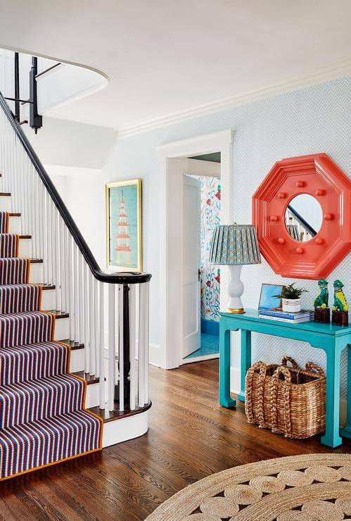 Stairs in entryway with turquoise table hexagon red mirror basket stair runner table lamp