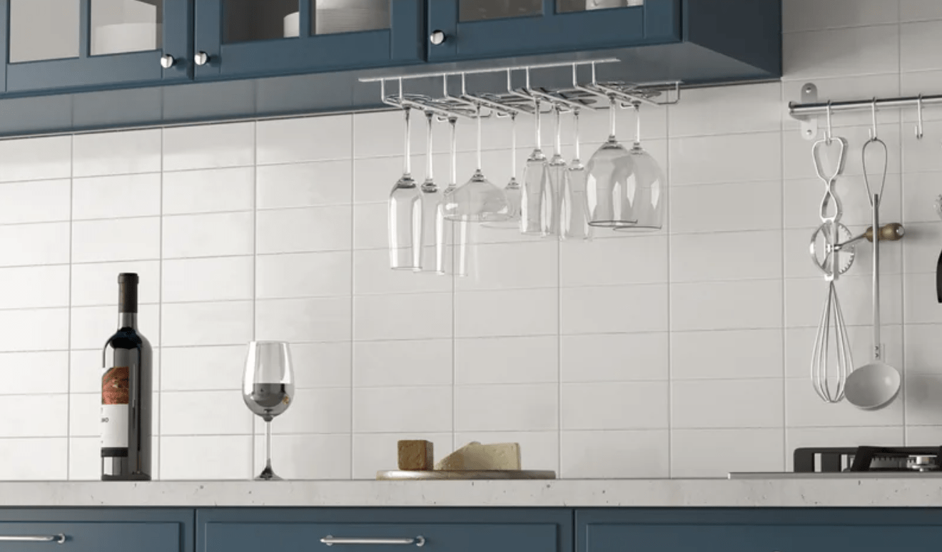 hanging wine glass holder under cupboard blue cabinetry