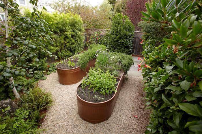 water trough garden beds copper in large garden gravel