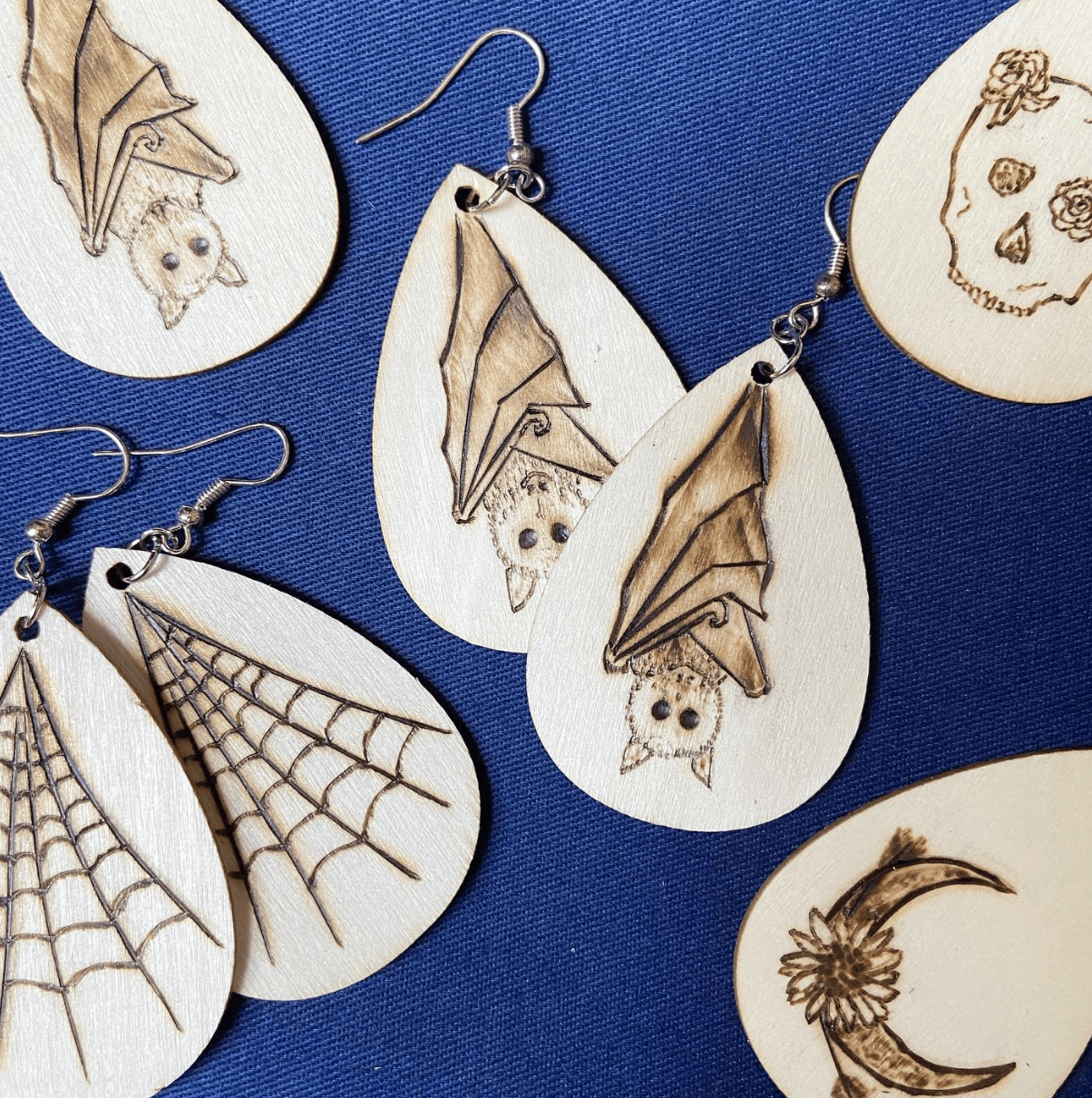 wood burnt earrings bats spider webs skull moon