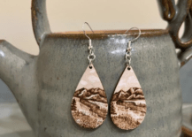 wood burnt earrings hanging for tea kettle