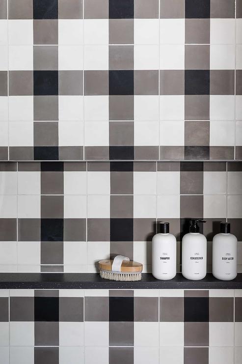 black and white buffalo check tiles and a rectangular tiled shower