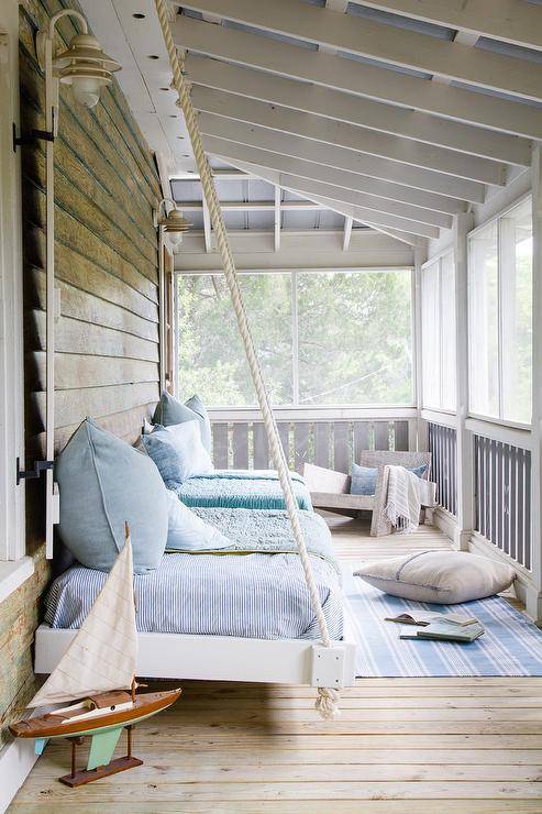 front porch with hanging bed swing blue coastal feel sailboat rub