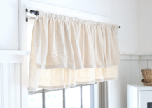 drop cloth valance curtain hanging in white kitchen window with black curtain rod