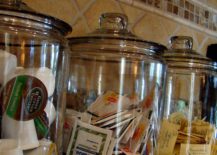glass large apothecary jars on counter with tea and sugar