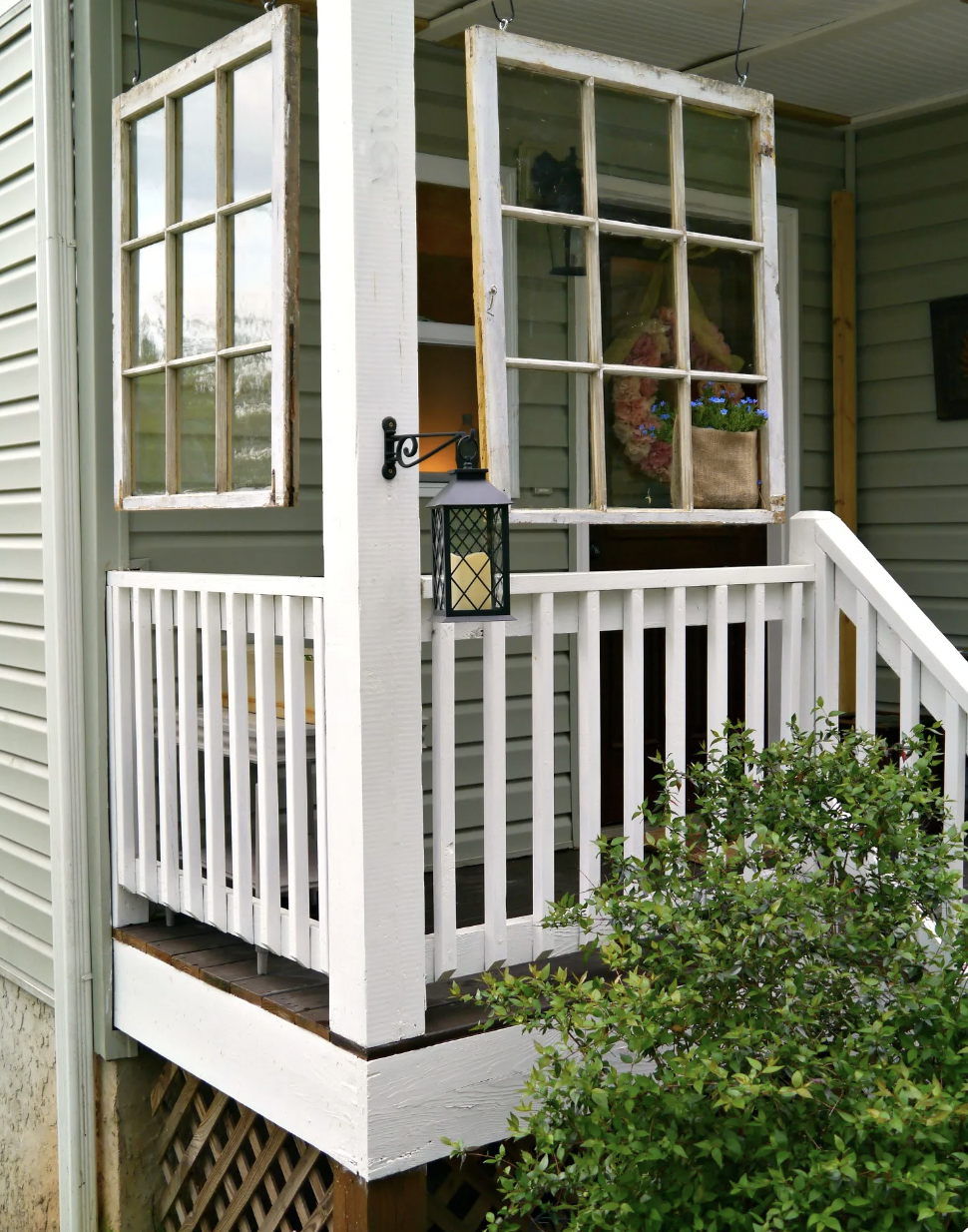 hanging old windows on front porch white rail lantern