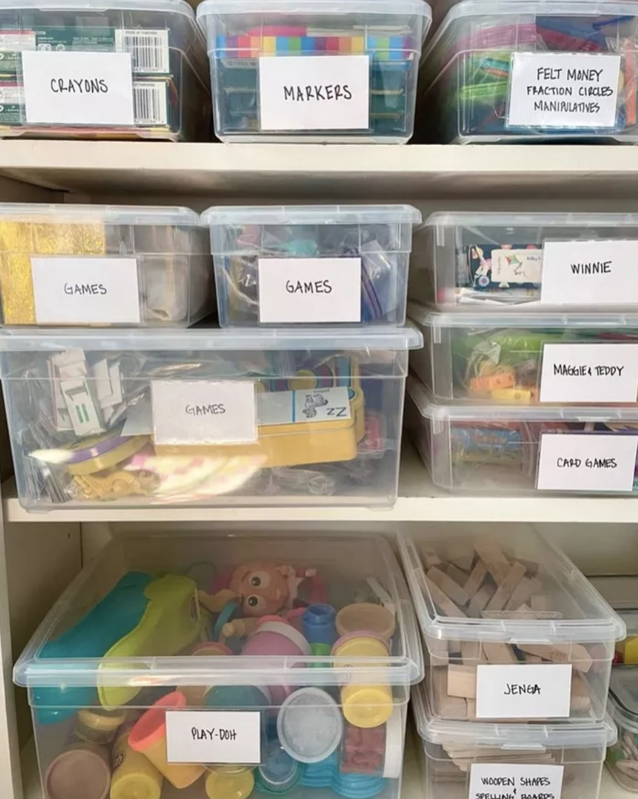 plastic toy storage bins with white labels