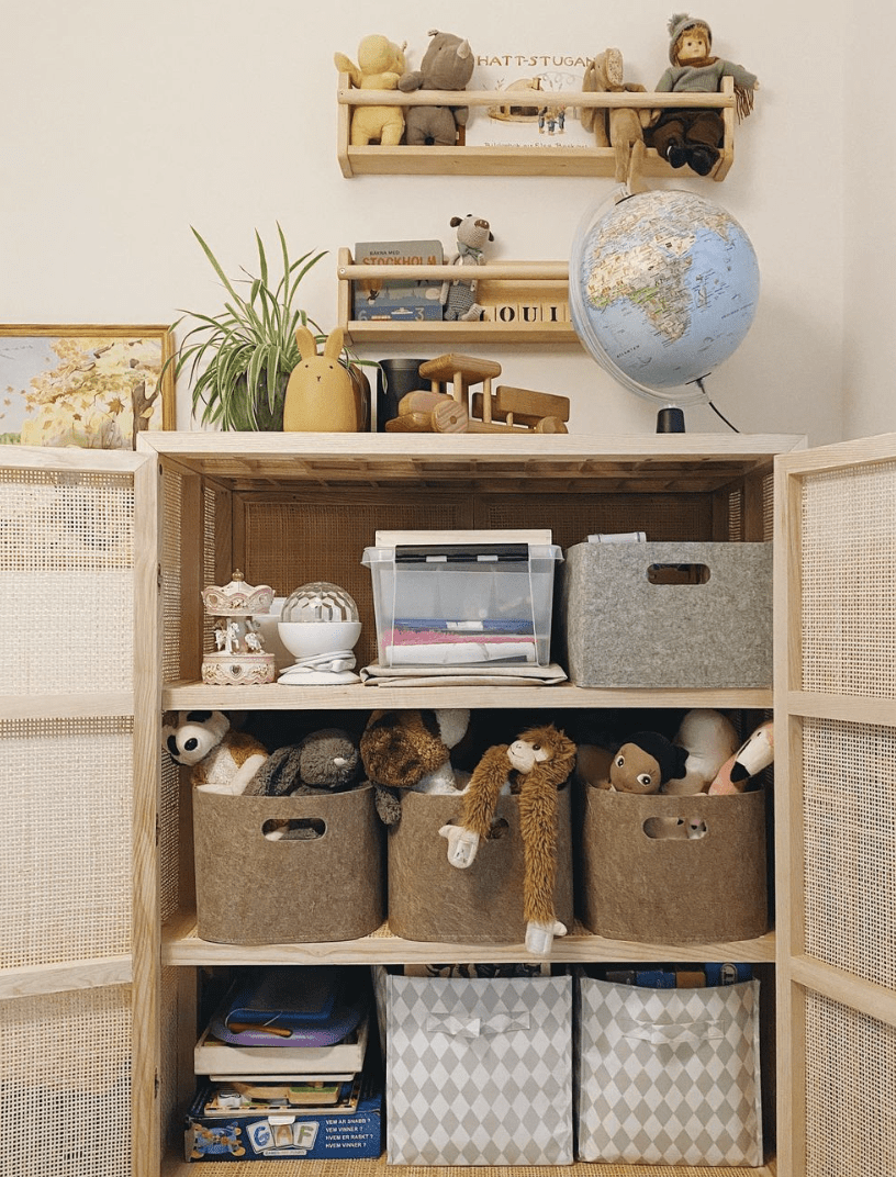 mesh cabinet open to reveal inside filled with toys and baskets