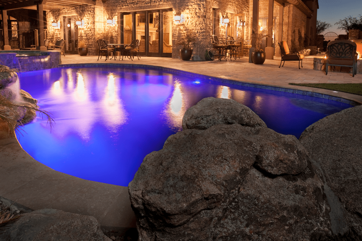 backyard pool lighting house stone