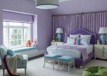 purple and blue color scheme bedroom with double bed ottomans at foot of bed purple wallpaper blue accent chair