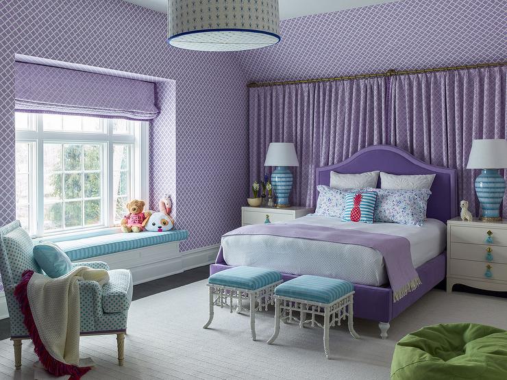 purple and blue color scheme bedroom with double bed ottomans at foot of bed purple wallpaper blue accent chair