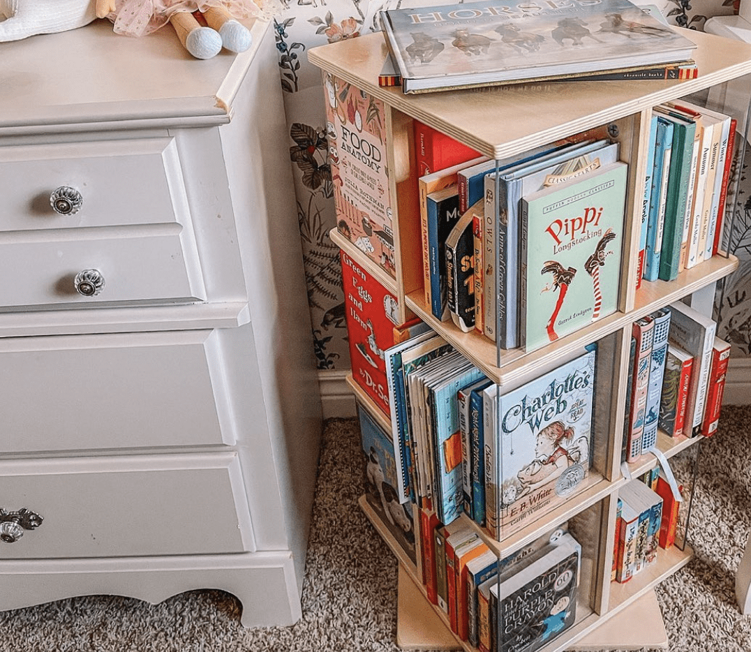 turning book shelf with books close up made of wood