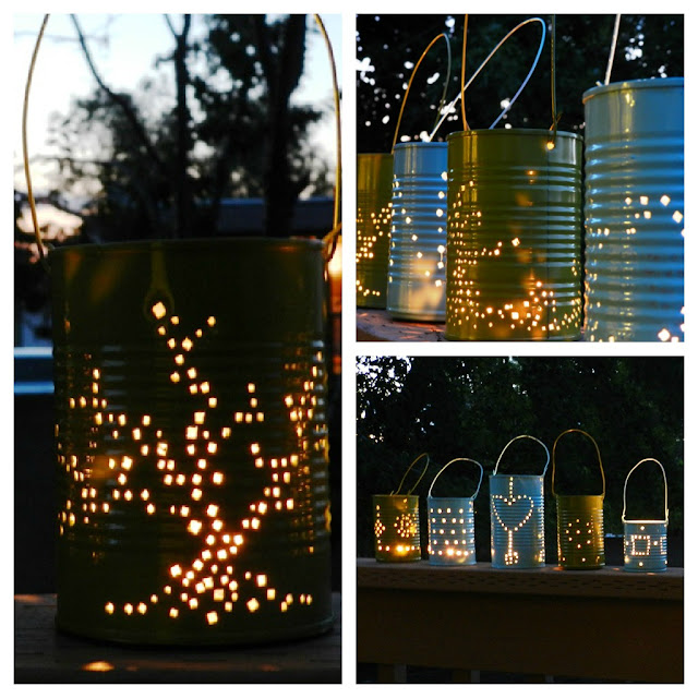 tin can lanterns painted blue and green lit up at night