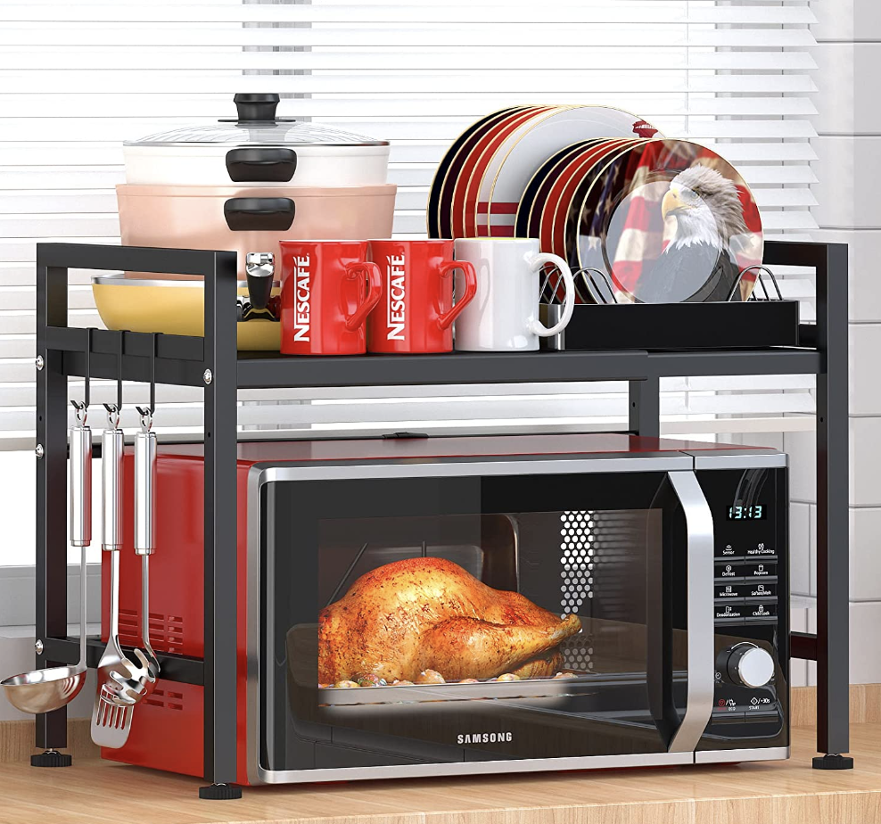 red toaster oven with wire rack over top holding kitchen items