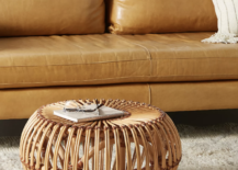rattan ottoman next to light leather brown couch
