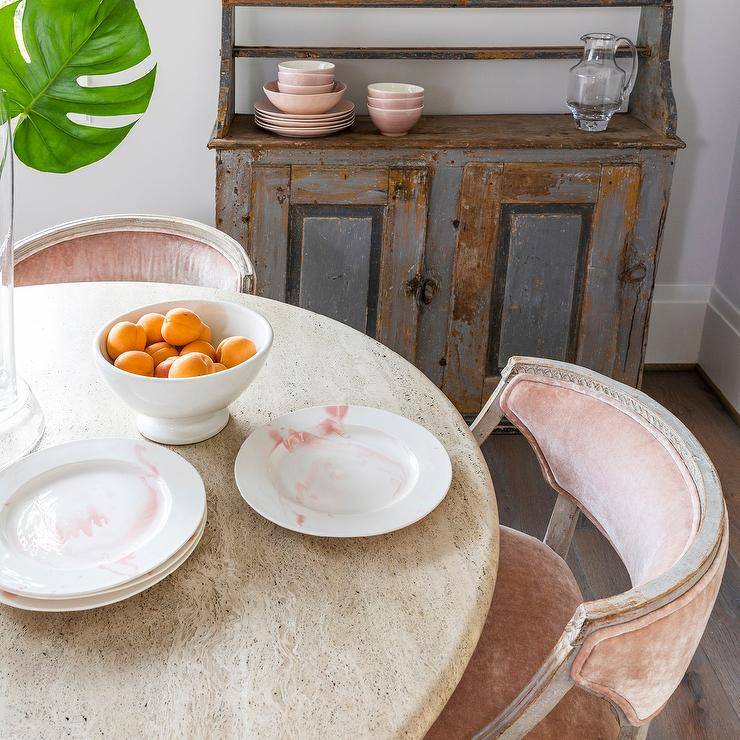 pastel pink velvet chair around round table