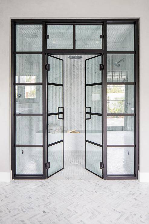 black frame doors walk in shower with white marble tiles