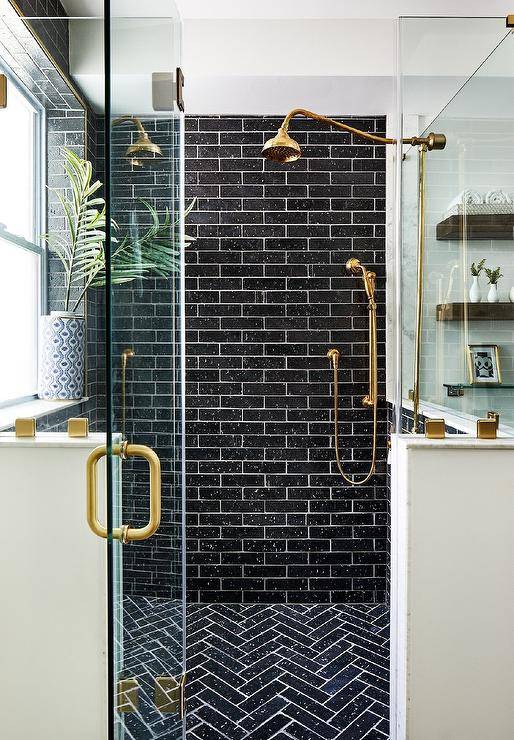 black subway tile with gold shower kit walk in with glass door