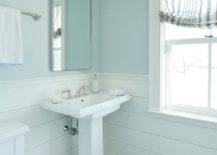 blue boys bathroom with pedestal sink step stool white shiplap wall
