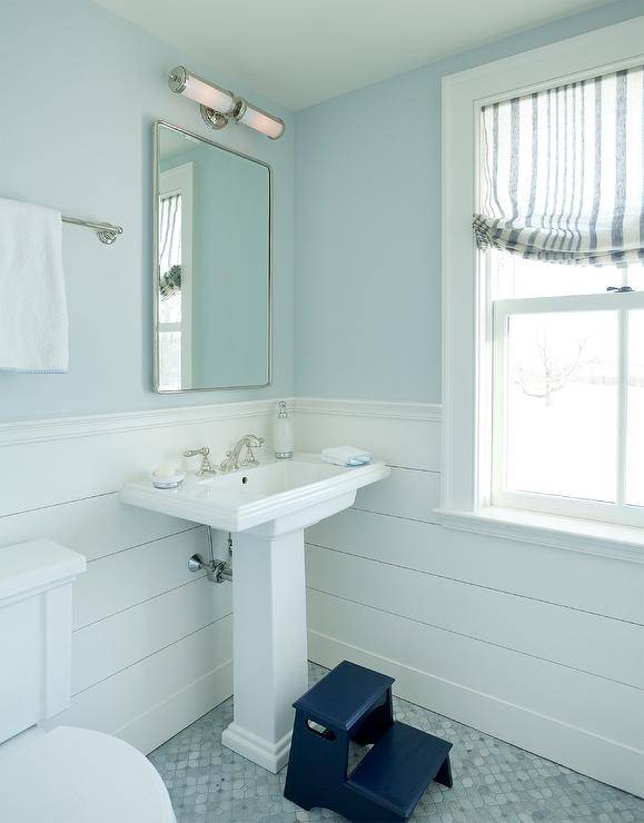 blue boys bathroom with pedestal sink step stool white shiplap wall