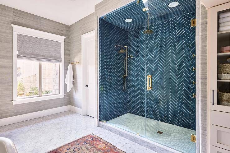 blue chevron tile walk in shower with gold shower kit rainfall shower head