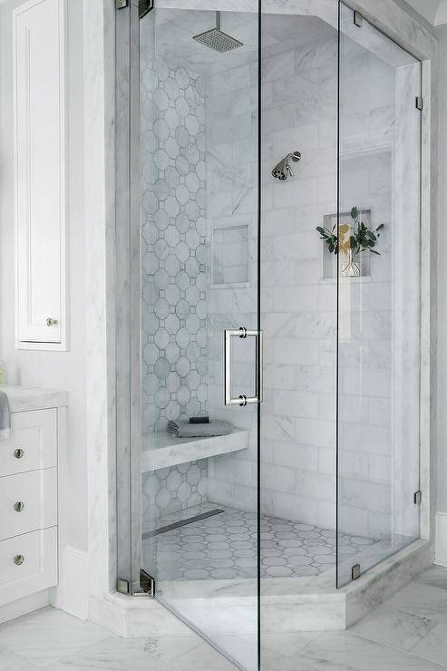 corner walk in shower with circle tiles glass door
