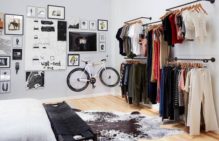 boys bedroom with open closet hanging rods unique gallery wall hanging bike black and white