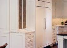 white cabinets with gold wire mesh