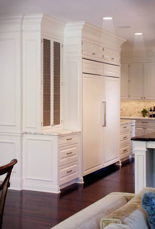 white cabinets with gold wire mesh