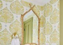 green wallpaper bathrrom with wood frame mirror marble top sink decorative flush mount light