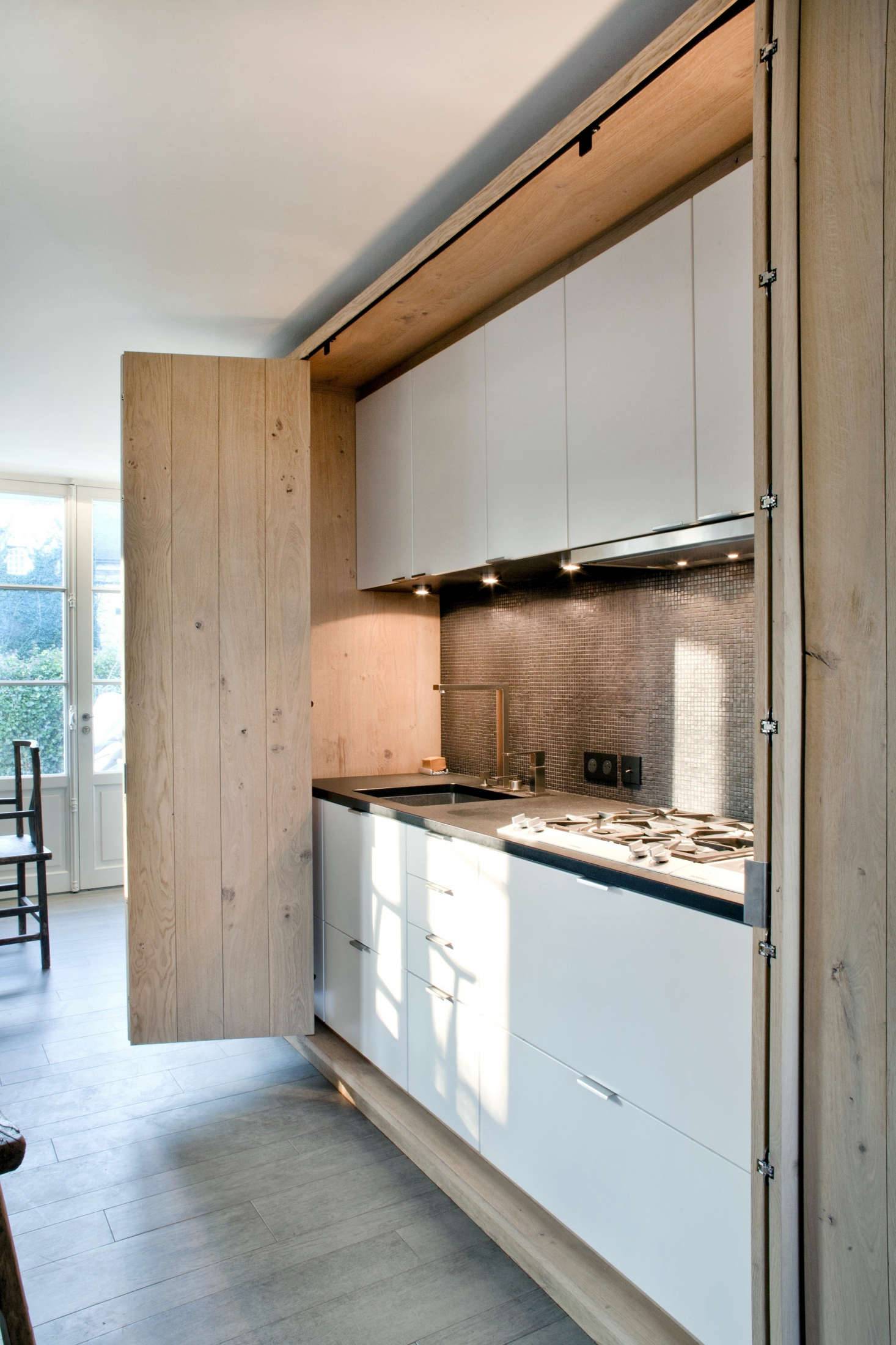 light wood hidden kitchen