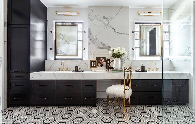 Stunning contemporary black, white and gold bathroom boasts white