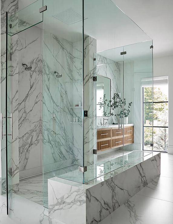 all marble walk in shower with glass doors in modern bathroom